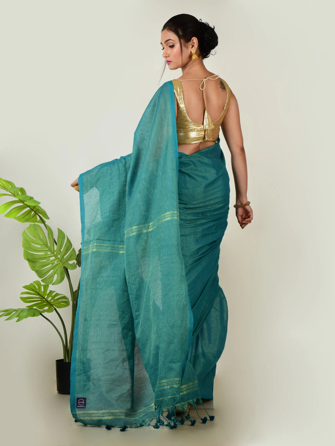 Mystic Lagoon | Turquoise Green Handloom Linen Saree with Golden Zari Stripe