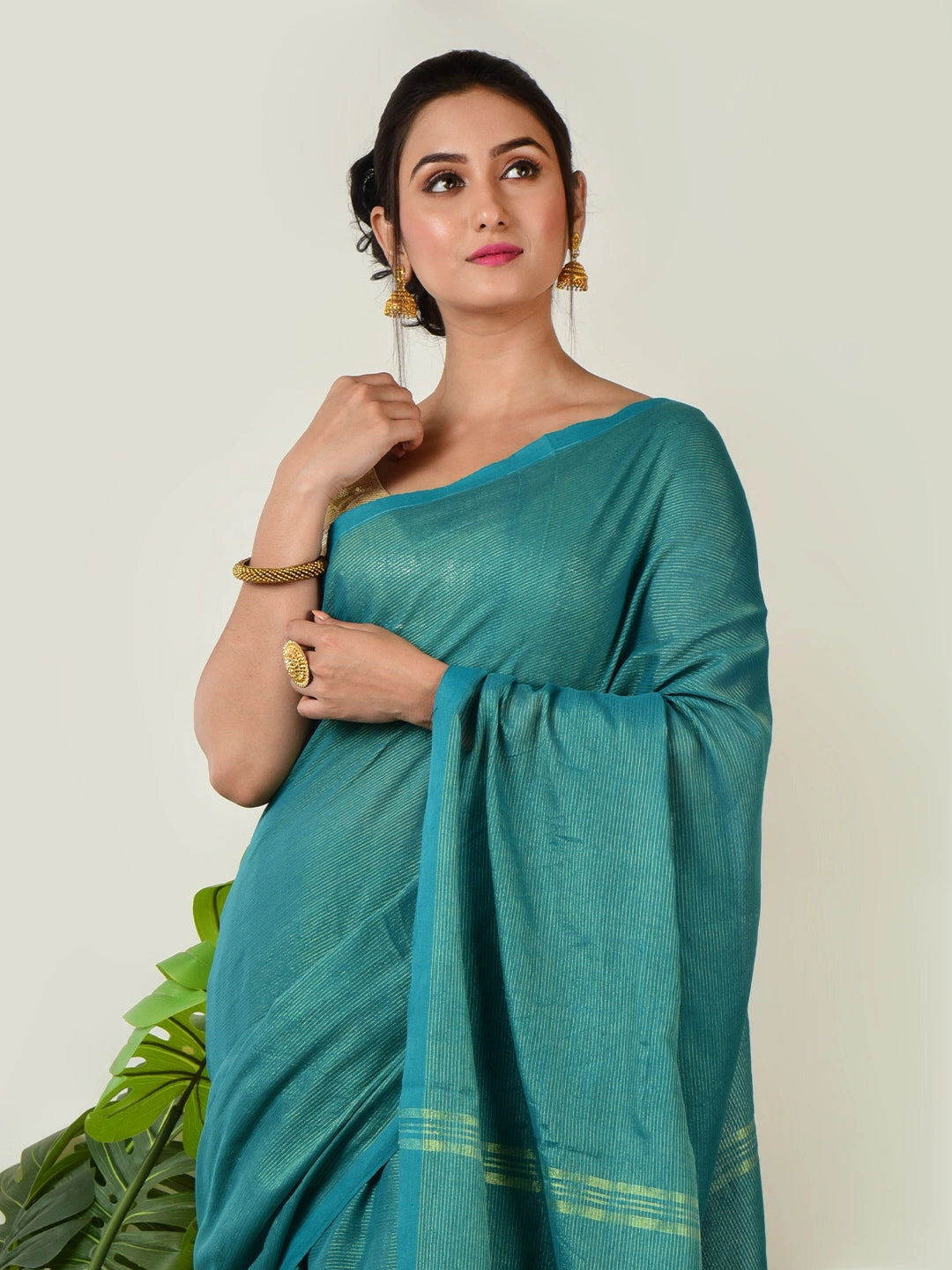 Mystic Lagoon | Turquoise Green Handloom Linen Saree with Golden Zari Stripe