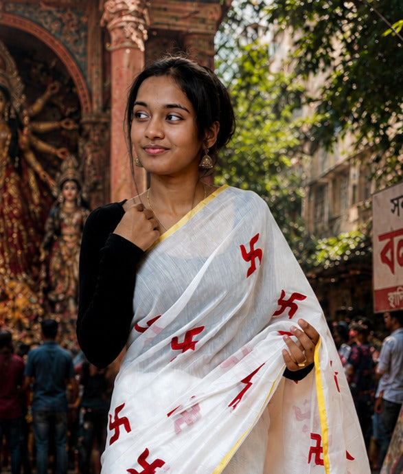 White Handloom Saree with Red Swastik Motifs & Yellow Border