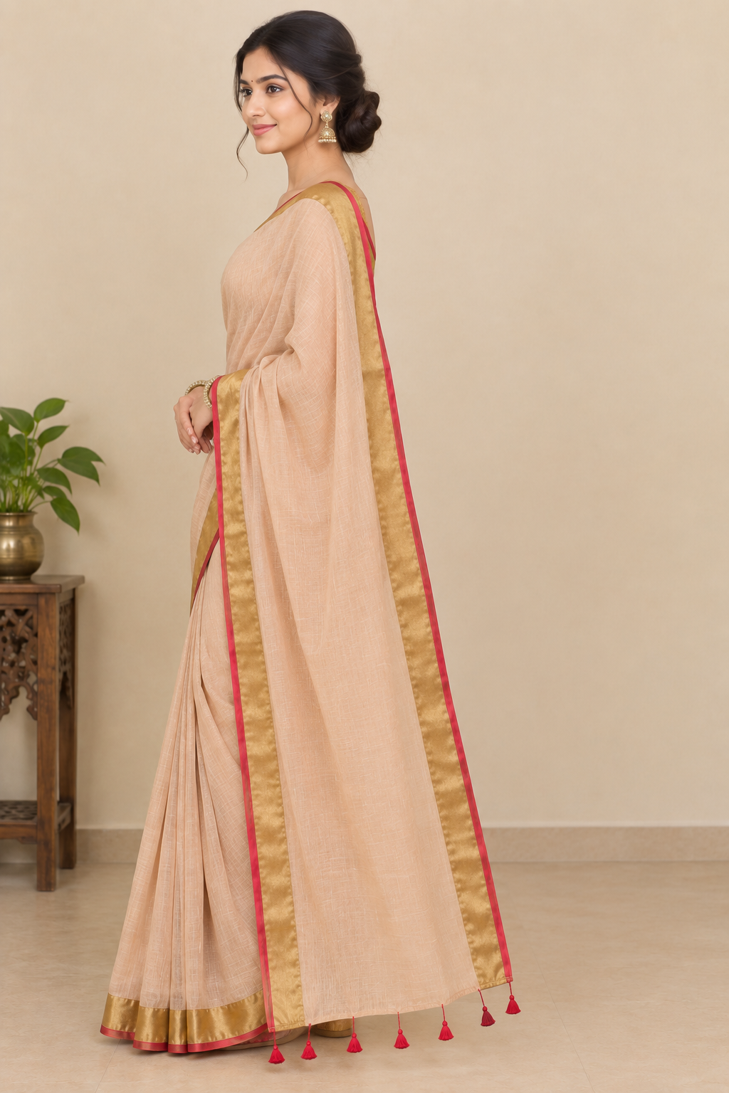 Peach Beige Cotton Saree with Golden Zari Border & Red Tassel Detailing