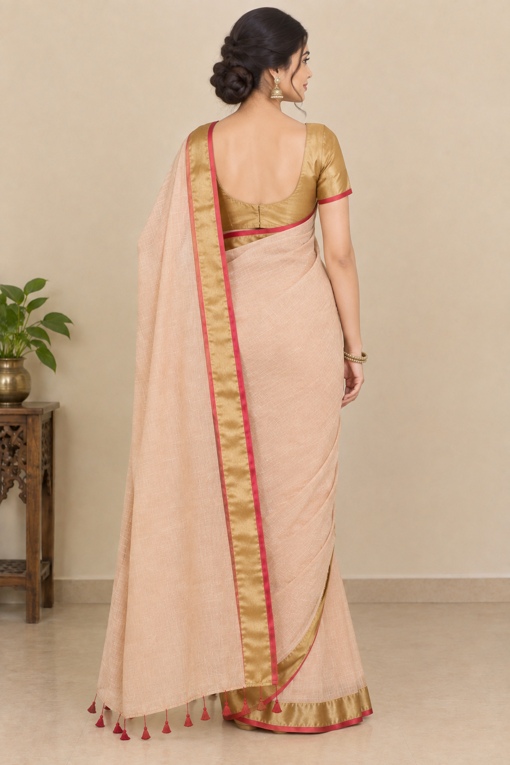 Peach Beige Cotton Saree with Golden Zari Border & Red Tassel Detailing